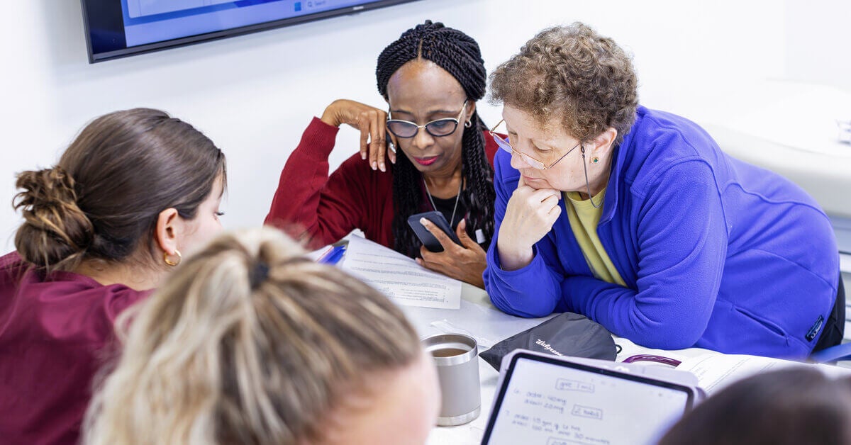 SJC nursing students with an instructor