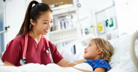 nurse with a pediatric patient